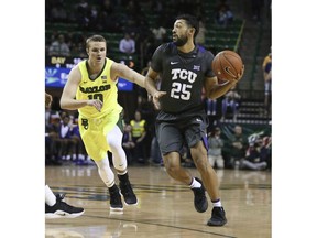 TCU guard Alex Robinson, right, drives around Baylor guard Makai Mason, left, in the first half of an NCAA college basketball game, Saturday, Feb. 2, 2019, in Waco, Texas.