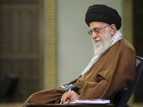 In this picture released on Jan. 12, 2019, by the official website of the office of the Iranian supreme leader, Supreme Leader Ayatollah Ali Khamenei takes notes during a meeting in Tehran, Iran. In a statement released on Wednesday Feb. 13, Iran's supreme leader said negotiations with the U.S. "will bring nothing but material and spiritual harm" -- remarks that come ahead of an American-led meeting on the Mideast in Warsaw. (Office of the Iranian Supreme Leader via AP)