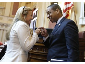 Virginia Lt. Gov Justin Fairfax, right, says goodbye to State Sen. Amanda Chase, R-Chesterfield, he exits the floor after the Senate adjourned their 2019 session at the Capitol in Richmond, Va., Sunday, Feb. 24, 2019. Fairfax delivered an impassioned speech and said "If we go backwards and we rush to judgment and we allow for political lynchings without any due process, any facts, any evidence being heard, then I think we do a disservice to this very body in which we all serve."