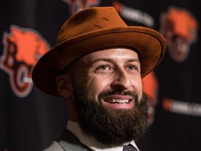 B.C. Lions quarterback Mike Reilly smiles while responding to questions after signing a four-year contract with the CFL football team, during a news conference in Surrey, B.C., on Tuesday February 12, 2019.