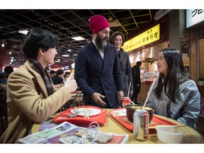 NDP Leader Jagmeet Singh, centre, campaigns for the federal byelection, in the food court at an Asian mall in Burnaby, B.C., on Sunday, Feb. 24, 2019. Byelections will be held Monday in three vacant ridings - Burnaby South, where Singh is hoping to win a seat in the House of Commons, the Ontario riding of York-Simcoe and Montreal's Outremont.