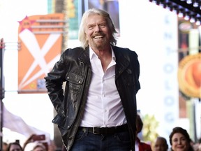In this Oct. 16, 2018 file photo, British business magnate Richard Branson appears at a ceremony honouring him with a star on the Hollywood Walk of Fame, in Los Angeles.