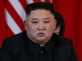 North Korean leader Kim Jong Un listens to President Donald Trump speak during a meeting, Thursday, Feb. 28, 2019, in Hanoi.