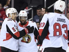 Ottawa Senators left wing Anthony Duclair, center, celebrates his goal with defenseman Cody Ceci, left, and defenseman Christian Jaros, right, during the first period of an NHL hockey game against the Washington Capitals, Tuesday, Feb. 26, 2019, in Washington.