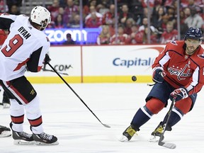 Washington Capitals left wing Alex Ovechkin (8), of Russia, battles for the puck against Ottawa Senators right wing Bobby Ryan (9) during the second period of an NHL hockey game, Tuesday, Feb. 26, 2019, in Washington.