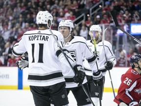 Los Angeles Kings right wing Tyler Toffoli (73) celebrates with center Anze Kopitar (11) after scoring a goal during the first period of an NHL hockey game against the Washington Capitals, Monday, Feb. 11, 2019, in Washington.