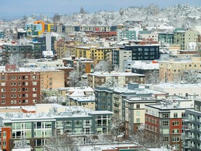 A snow covered Capitol Hill neighborhood seen from First Hill in Seattle, Saturday, Feb. 9, 2019. Residents of the Pacific Northwest took to neighborhood hills with skis, sleds or even just laundry baskets Saturday to celebrate an unusual dump of snow in a region more accustomed to winter rain.