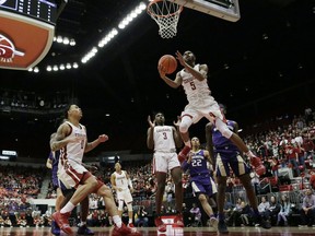 Washington State forward Marvin Cannon (5) shoots during the first half of an NCAA college basketball game against Washington in Pullman, Wash., Saturday, Feb. 16, 2019.