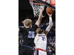 Gonzaga forward Rui Hachimura (21) shoots while defended by San Diego forward Yauhen Massalski (25) during the first half of an NCAA college basketball game in Spokane, Wash., Saturday, Feb. 2, 2019.