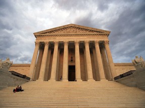 FILE - In this Oct. 18, 2018 file photo, the U.S. Supreme Court is seen at near sunset in Washington, Thursday. The Supreme Court is ending a long legal fight by ruling that a Texas death row inmate is intellectually disabled and thus may not be executed. The justices ruled 6-3 Tuesday in the case of inmate Bobby James Moore.