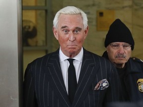 In this Feb. 1, 2019 photo, former campaign adviser for President Donald Trump, Roger Stone, leaves federal court in Washington.   U.S. District Judge Amy Berman Jackson has issued a gag order in the case of Donald Trump confidant Roger Stone.  Jackson said in an order Friday that both sides must refrain from making statements to the media or the public that could prejudice the case.