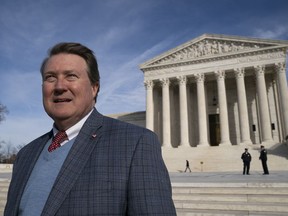 Mitch Hungerpiller of Birmingham, Ala., who invented a computerized system to automate the processing of returned mail, visits the Supreme Court in Washington, on Feb. 14, 2019, where his decade-long fight with the post office over patent infringement will be heard.