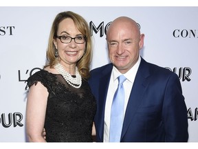 FILE- In this Nov. 12, 2018, file photo politician and gun control advocate Gabrielle Giffords and husband, retired astronaut Mark Kelly, attend the Glamour Women of the Year Awards at Spring Studios in New York. Kelly is kicking off his U.S. Senate campaign Saturday, Feb. 23, 2019 with a rally in Tucson.