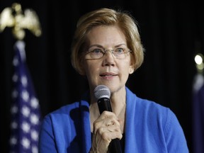 In this Feb. 10, 2019, photo, Sen. Elizabeth Warren, D-Mass., speaks to local residents during an organizing event in Cedar Rapids, Iowa. The nearly half-dozen Democratic senators also seeking their party's 2020 presidential nomination are facing a juggling act, crisscrossing the country while keeping an eye on their constituents and making it to votes in Washington.