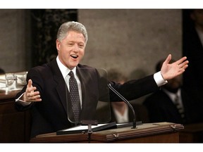 FILE - In this Jan. 19, 1999, file photo, President Bill Clinton gestures while giving his State of the Union address on Capitol Hill in Washington. President Donald Trump will deliver his State of the Union address at one of the most contentious times in his stewardship of the nation, but others may have had it worse: Abraham Lincoln had the Civil War, Richard Nixon was caught up in Watergate and Clinton was impeached.