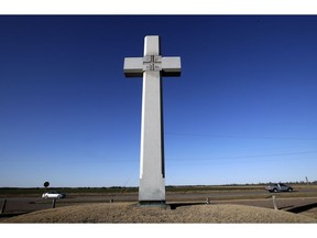 A cross, erected in memory of Fray Juan de Padilla, stands along US56 near Lyons, Kan., Tuesday, Feb. 12, 2019. The cross was a gift to the State of Kansas by the Knights of Columbus in 1950. Father Padilla traveled with Coronado and died a martyr's death in 1542. The Supreme Court this week will hear a case challenging a nearly 100-year-old, cross-shaped Maryland war memorial.