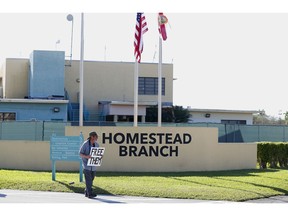 In this Feb. 19, 2019, photo, Josh Rubin demonstrates in front of the Homestead Temporary Shelter for Unaccompanied Children in Homestead, Fla. House Democrats are laying the groundwork to subpoena Trump administration officials over family separations at the southern border.