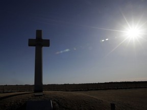 A cross, erected in memory of Fray Juan de Padilla, stands along US56 near Lyons, Kan., Tuesday, Feb. 12, 2019. The cross was a gift to the State of Kansas by the Knights of Columbus in 1950.