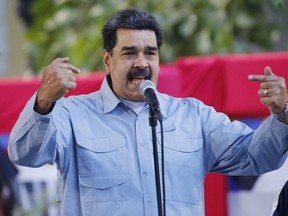 Venezuela's President Nicolas Maduro speaks during an event at Bolivar Square in Caracas, Venezuela, Thursday, Feb. 7, 2019. Maduro said that he hopes to collect 10 million signatures demanding that Washington withdraw threats of war against the people of Venezuela.