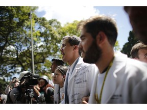 Opposition National Assembly President Juan Guaido, who declared himself interim president of Venezuela, takes part in a walk out against President Nicolas Maduro, in Caracas, Venezuela, Wednesday, Jan. 30, 2019. Venezuelans are exiting their homes and workplaces in a walkout organized by the opposition to demand that Maduro leave power.