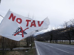 A flag flutters at the entrance of the No-TAV movement headquarters in Venaus, northern Italy, Tuesday, Feb. 12, 2019. The TAV project is part of a European wide network to improve high-speed rail connections. On the Italian side, the construction site long targeted by sabotaging protesters is guarded by four law enforcement agencies and has been reduced to maintenance work only. The survival of Italy's increasingly uneasy populist government could very well depend on whether Italy restarts construction on the TAV link, which it halted in June.