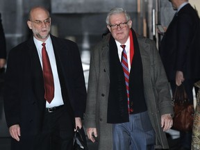 Department of Commerce Under Secretary of Commerce for International Trade Gilbert Kaplan, right, leaves the hotel in Beijing, Wednesday, Feb. 13, 2019. U.S. Treasury Secretary Steven Mnuchin and Trade Representative Robert Lighthizer has arrive to China's capital to hold a new round of high-level trade talks with China on Feb. 14-15.