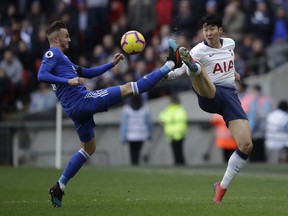 Leicester City's James Maddison, left, vies for the ball with Tottenham Hotspur's Son Heung-min during the English Premier League soccer match between Tottenham Hotspur and Leicester City at Wembley stadium in London, Sunday, Feb. 10, 2019.