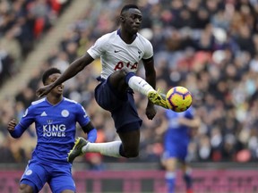 Tottenham Hotspur's Davinson Sanchez kicks the ball during the English Premier League soccer match between Tottenham Hotspur and Leicester City at Wembley stadium in London, Sunday, Feb. 10, 2019.