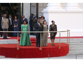 South African President, Cyril Ramaphosa, center, takes the national salute at parliament in Cape Town, South Africa, Thursday, Feb. 7, 2019 for the State Of The Nation address. Ramaphosa is set to give his second address to parliament just months before national elections seen by many as a referendum on his ruling African National Congress party.