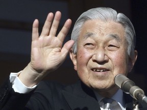 FILE - In this Jan. 2, 2019, file photo, Japan's Emperor Akihito waves to well-wishers from the bullet-proofed balcony during his New Year's public appearance with his family members at Imperial Palace in Tokyo. Akihito has devoted his 30-year reign to making amends for a war fought in his father's name, while adapting the 1,500-year-old monarchy to draw the Imperial Family closer to the public.