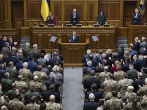 European Council President Donald Tusk, center, address to Ukrainian parliament in Kiev, Ukraine, Monday Feb. 19, 2019.