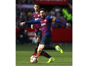 Barcelona forward Lionel Messi kicks the ball during La Liga soccer match between Sevilla and Barcelona at the Ramon Sanchez Pizjuan stadium in Seville, Spain. Saturday, February 23, 2019.