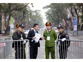 Security guards stand at a barricaded outside Melia Hotel where North Korean leader Kim Jong Un was expected to stay, in Hanoi, Vietnam, Tuesday, Feb. 26, 2019. Kim arrived in Vietnam Tuesday for his second summit with U.S. President Donald Trump.