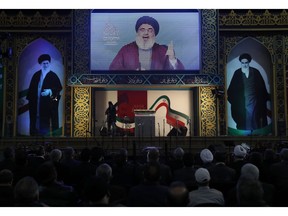 Hezbollah leader Sayyed Hassan Nasrallah delivers a live broadcast speech, during a rally to commemorate the 40th anniversary of Iran's Islamic Revolution, in southern Beirut, Lebanon, Wednesday, Feb. 6, 2019. Nasrallah says Iran won't be fighting alone in the event that United States launches launch a war against it. He says the Islamic Republic is the strongest state in the region, and the so-called axis of resistance led by Iran is the strongest it has ever been.
