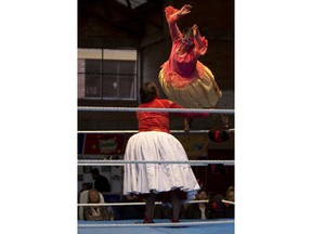 Young cholita wrestler Nelly Pankarita jumps over her young rival Eleonor as they compete in the ring in El Alto, Bolivia, Sunday, Feb. 24, 2019. "I love those leaps of Reyna, and it's a dream that she's teaching us," said 17-year-old Nieves Laura Tarqui, who wrestles as Nelly Pankarita, a last name that means "Little Flower" in Aymara.