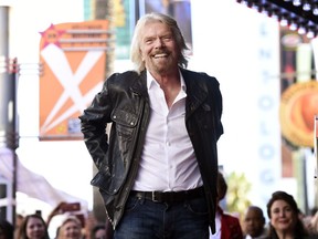 FILE - In this Oct. 16, 2018 file photo, British business magnate Richard Branson appears at a ceremony honoring him with a star on the Hollywood Walk of Fame, in Los Angeles. Branson said on Monday, Feb. 18, 2019, that he hopes that the concert that he is throwing for a humanitarian aid effort for Venezuela helps saves lives by raising funds for "much-needed medical help."