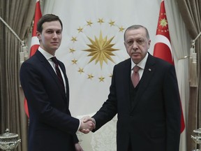 Turkey's President Recep Tayyip Erdogan, right, shakes hands with Jared Kushner, left, U.S. President Donald Trump's adviser, prior to their meeting at the Presidential Palace in Ankara, Turkey, Wednesday, Feb. 27, 2019. Erdogan met with with U.S. President Donald Trump's adviser and son-in-law for talks that are expected to centre on his planned Mideast peace initiative. Turkey's Economy Minister Berat Albayrak, who is Erdogan's son-in-law, was also present. (Presidential Press Service via AP, Pool)