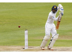 Sri Lanka's Oshada Fernando plays a shot during their third day of the second cricket test at St. George's Park in Port Elizabeth, South Africa between South Africa and Sri Lanka Saturday, Feb. 23, 2019.