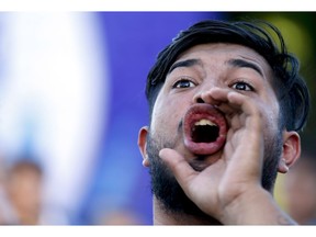 A man shouts during a protest against U.S. intervention in Venezuela, outside the U.S embassy in Buenos Aires, Argentina, Tuesday, Feb. 5, 2019. Venezuelan President Nicolas Maduro accuses the United States of trying to orchestrate a coup against him, and that allegation has resonance among many in a region where Washington has a long history of interventions -- military and otherwise.