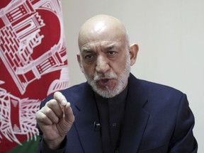 Former Afghan President Hamid Karzai speaks during an interview with The Associated Press in Kabul, Afghanistan, Saturday, Feb. 16, 2019. Karzai expressed fears that a previously unscheduled meeting between the Taliban and the United States in Pakistan on Monday risks engulfing Afghanistan into regional rivalries, as its neighbors and powerful Persian Gulf states jockey for influence in a post- U.S. Afghanistan.