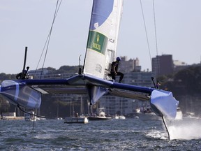 The French F50 catamaran lifts out of the water during their SailGP race on the harbor in Sydney, Friday, Feb. 15, 2019. A fleet of six super-charged F50 catamarans capable of reaching speeds up to 90 kilometers per hour (55 mph) are representing different nations in the two-day, six- race event.