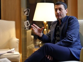 French writer Frederic Martel gestures during an interview with Associated Press, in Paris, Friday, Feb. 15, 2019. In the explosive book "In the Closet of the Vatican" author Frederic Martel describes a gay subculture at the Vatican and calls out the hypocrisy of Catholic bishops and cardinals who in public denounce homosexuality but in private lead double lives.