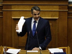 Greek opposition New Democracy party leader Kyriakos Mitsotakis speaks during a parliament session in Athens, Friday, Feb. 8, 2019. Greek lawmakers are set Friday to approve Macedonia's NATO accession, ending a process to normalize relations between the two neighbors and anchor the country -- renamed North Macedonia -- firmly within the western sphere of influence.
