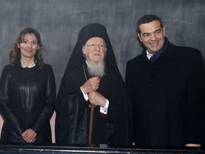 Greece's Prime Minister Alexis Tsipras, right, his partner Betty Baziana, left, and Ecumenical Patriarch Bartholomew I pose for the photographers during their visit at the Theological School of Halki, in Heybeli Island, near Istanbul, Wednesday, Feb. 6, 2019. The president of Turkey and the prime minister of Greece agreed Tuesday on the need to keep "channels of dialogue" open between their countries, which have come to the brink of war three times since the early 1970s and remain divided over an array of issues.
