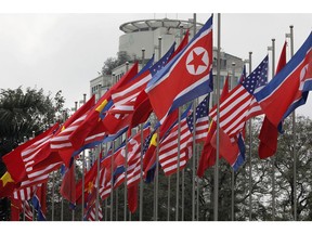 National flags of the U.S. North Korea and Vietnam are displayed at the International Media Center for the U.S-North Korean summit in Hanoi, Vietnam, Monday, Feb. 25, 2019. The second summit between U.S. President Donald Trump and North Korean leader Kim Jong Un will take place in Hanoi on Feb. 27 and 28.
