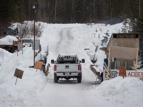 A Coastal GasLink contractor drives over a bridge at the Unist'ot'en camp on a remote logging road near Houston, B.C., on Thursday January 17, 2019.