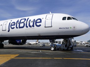 In this March 16, 2017, file photo, a JetBlue airplane is seen at John F. Kennedy International Airport in New York.