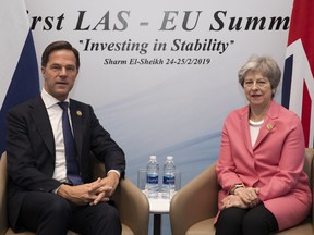 Netherlands' Prime Minister Mark Rutte and British Prime Minister Theresa May hold bilateral talks during the first Arab-European Summit on February 25, 2019 in Sharm El Sheikh, Egypt.