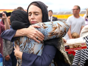 Prime Minister Jacinda Ardern hugs a mosque-goer at the Kilbirnie Mosque on March 17, 2019 in Wellington.