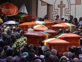 Mourners and family members escort the coffins of the Ethiopian passengers and crew who perished in the Ethiopian Airways crash to a mausoleum at Selassie Church in Addis Ababa, Ethiopia.